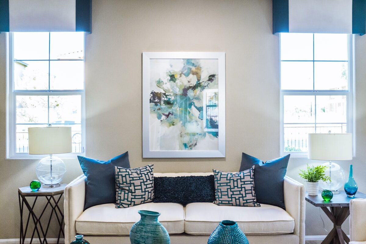 Airy living room with blue accents and framed artwork
